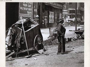 Worker Pausing During Street Work Near the Southwest Corner of Chestnut Street and 12th Street, Now Tucker Boulevard